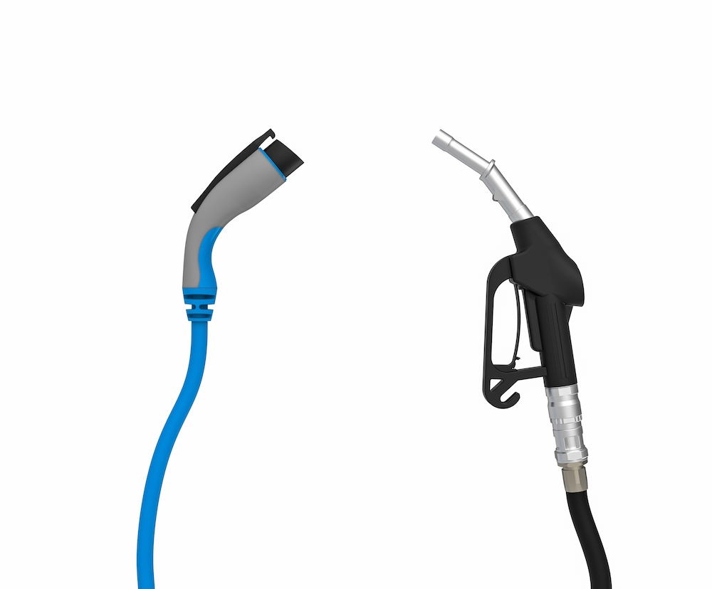 gas-nozzle-vs-electric-vehicle-charging-plug-isola-2023-11-27-04-49-29-utc
